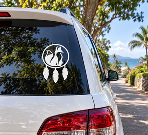 Fox dreamcatcher vinyl decal on car window: circular fox silhouette with hanging feathers