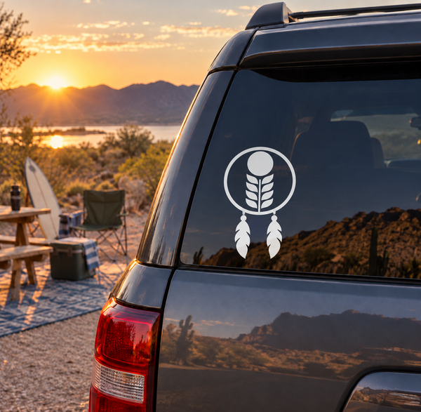 Vinyl dreamcatcher decal with moon and feather design on a car window