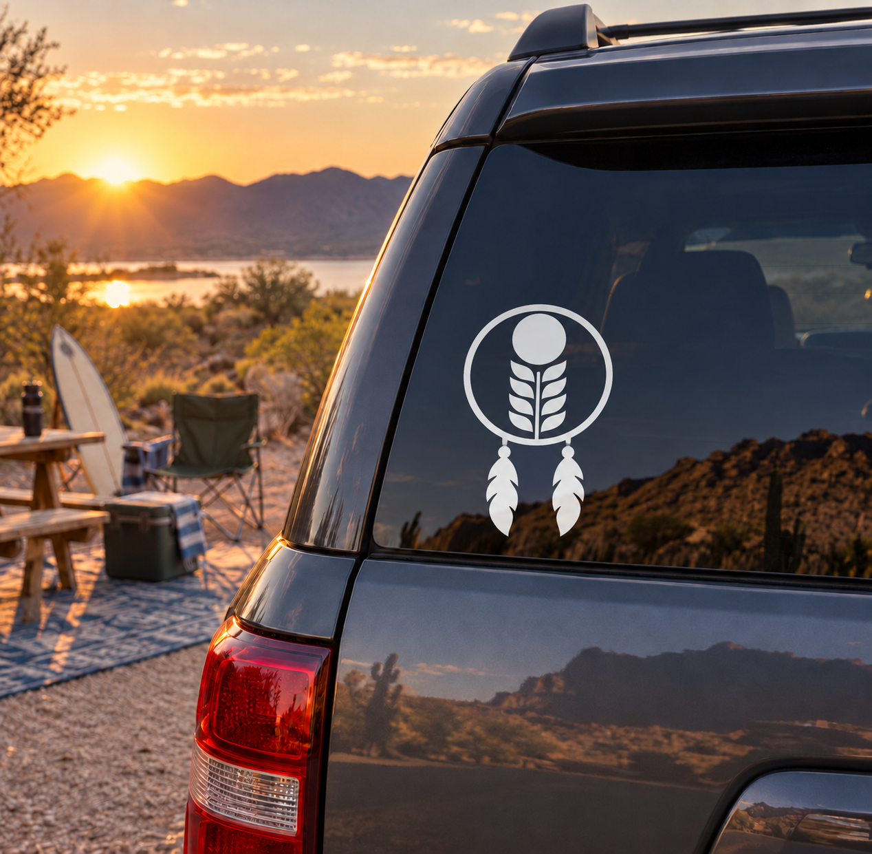 Vinyl dreamcatcher decal with moon and feather design on a car window