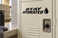 Stay hydrated vinyl decal with bold text and water-drop icon