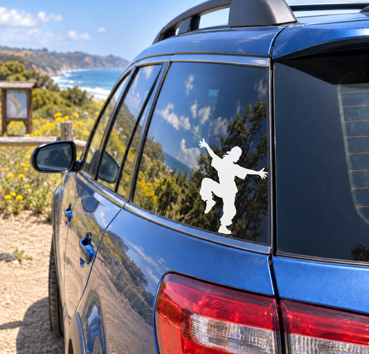 Vinyl car decal of white dancing silhouette on rear side window