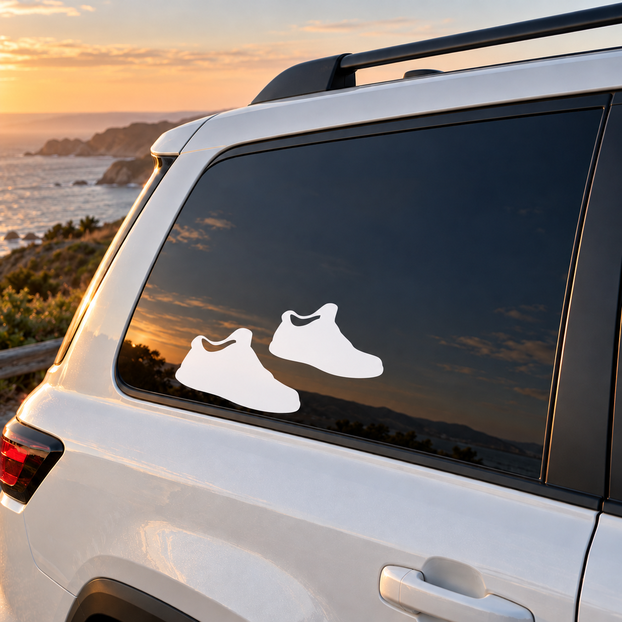 Vinyl sneaker decal pair on car window: white sneaker silhouettes