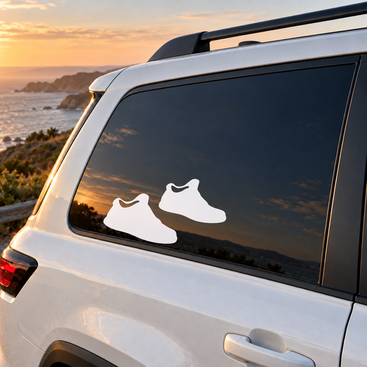 Vinyl sneaker decal pair on car window: white sneaker silhouettes