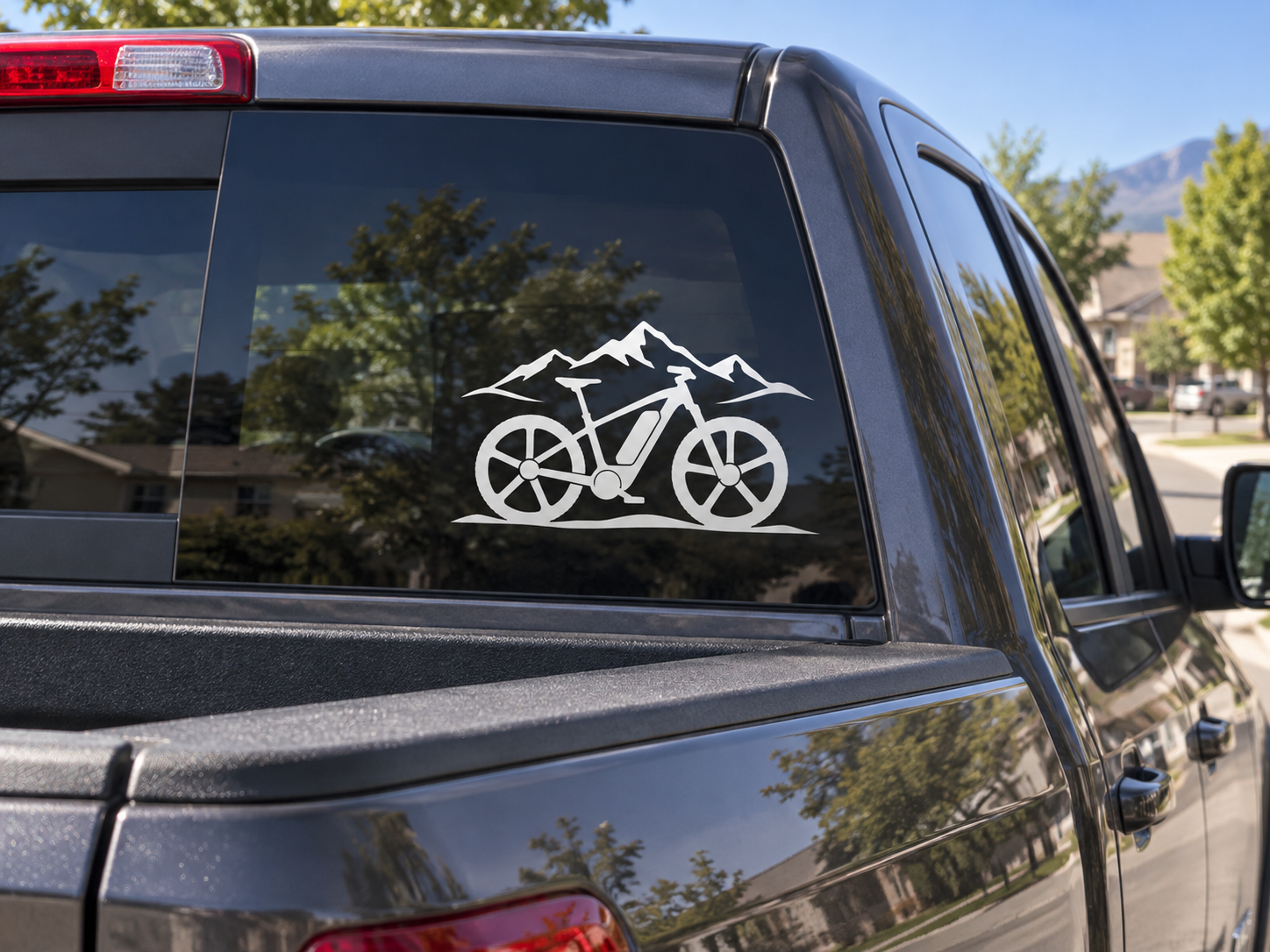 Electric mountain e-bike vinyl decal with mountain outline and bike silhouette on window