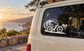 E-bike vinyl decal on window: black wave, bicycle, and coastal scenery graphic