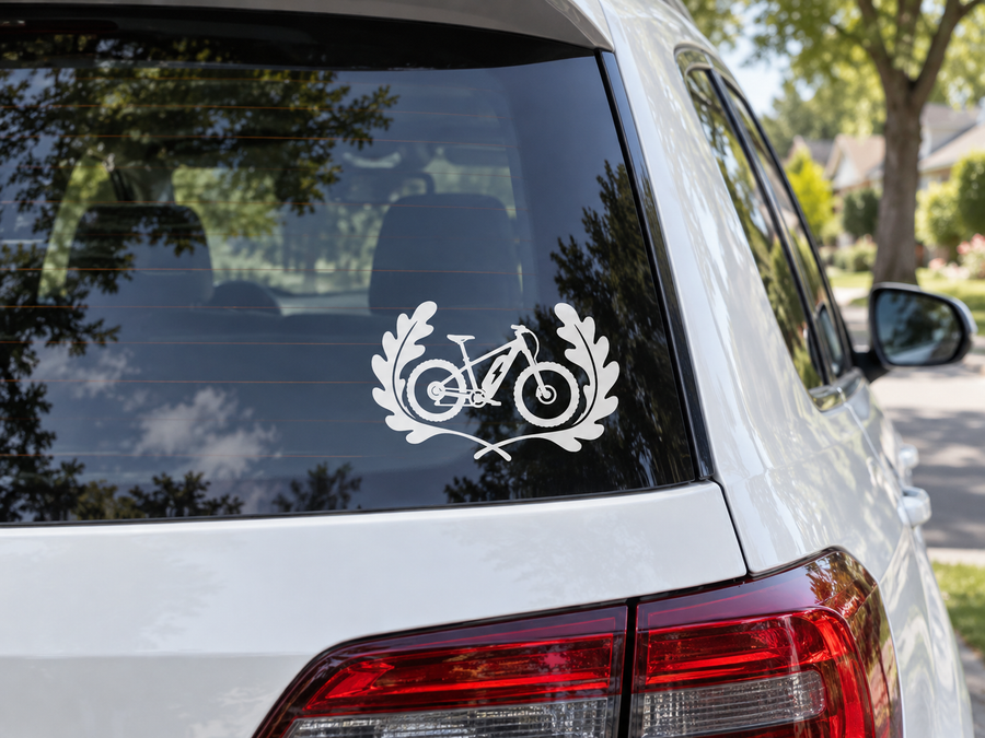 Electric bike trail vinyl decal on vehicle rear window, white bike and laurel graphic