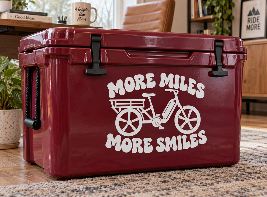 Red storage bin with white “More Miles, More Smiles” bicycle vinyl decal
