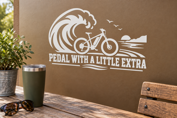 White vinyl e-bike pedal decal with roaring wave graphic and 'PEDAL WITH A LITTLE EXTRA'