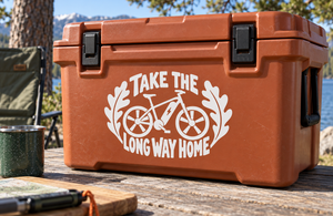 White bicycle vinyl decal reading Take the Long Way Home with winged wheel graphic