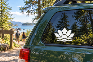 Lotus vinyl decal on car window: black lotus with white outline and wave base.