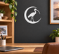 Ibis crescent vinyl decal, white on dark wall with bird silhouette