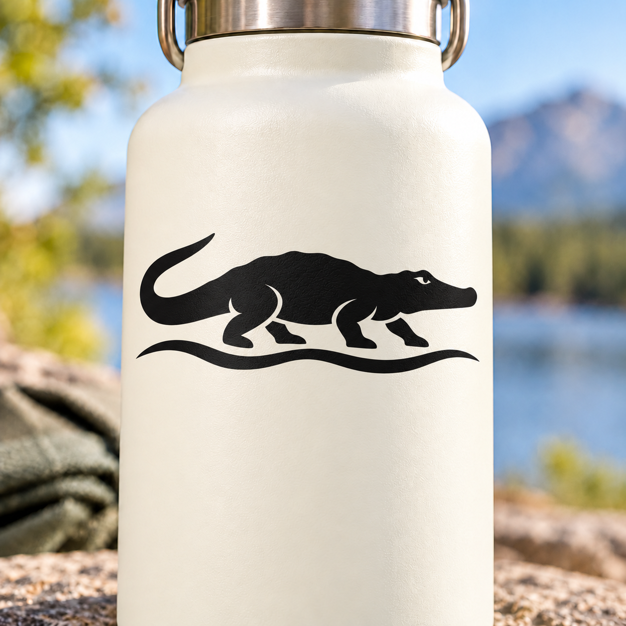Black crocodile river vinyl decal silhouette with footprints on a light surface