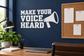 Vinyl decal reading "MAKE YOUR VOICE HEARD" with megaphone graphic, white text on dark background