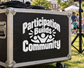 Black vinyl decal with white "Participation Builds Community" text and people icon