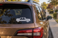 Electric vehicle pickup profile vinyl decal on rear window, white outline