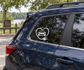 Electric vehicle heart cable vinyl decal on car window, white outline with car and plug