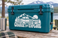 Electric vehicle charge and explore vinyl decal on teal cooler with car, mountains, trees
