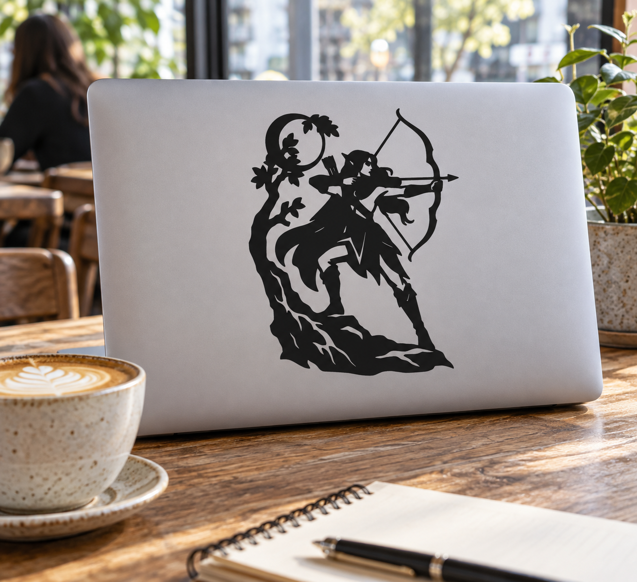 Wildwood Archer vinyl decal: black elf archer silhouette on light laptop lid
