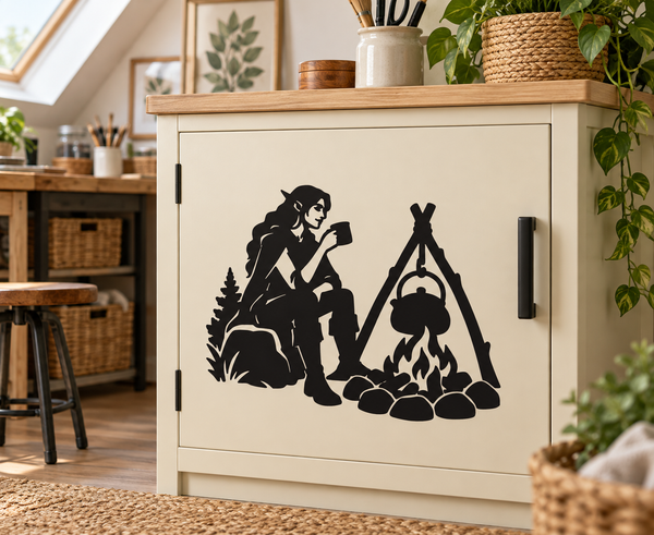 Black vinyl decal of an elf tending a campfire with a kettle hanging from a tripod