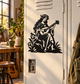 Musician vinyl decal of a flower-crown elf playing guitar, black silhouette