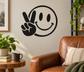Smiley peace-hand vinyl decal, black outline with round face and hand