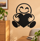 Vinyl wall decal of a smiling face holding a large black heart with open arms