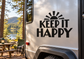 Vinyl decal with black “KEEP IT HAPPY” text and sunburst icon on a vehicle panel.