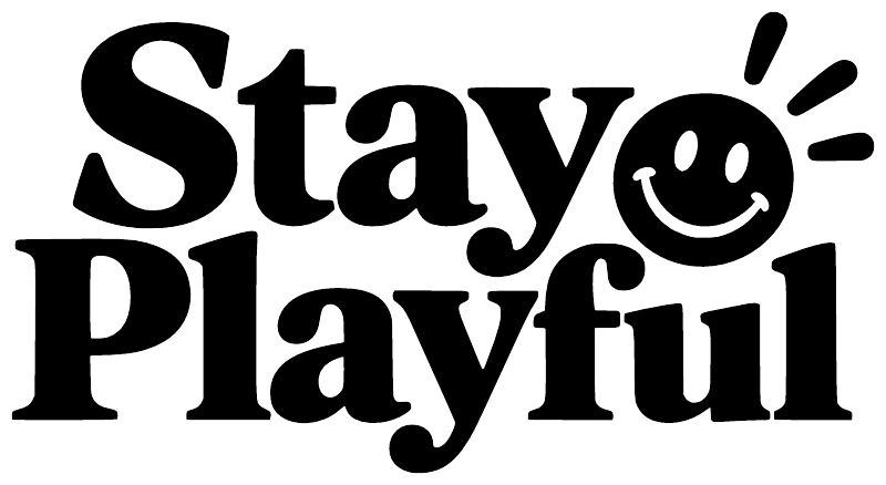 Black vinyl wall decal: “Stay Playful” with smiling emoji face and decorative rays
