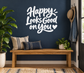 Vinyl wall decal with "Happy! Looks Good on You" script lettering in white