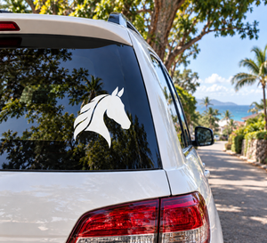 Horse head vinyl decal in white, quiet profile style on a car window
