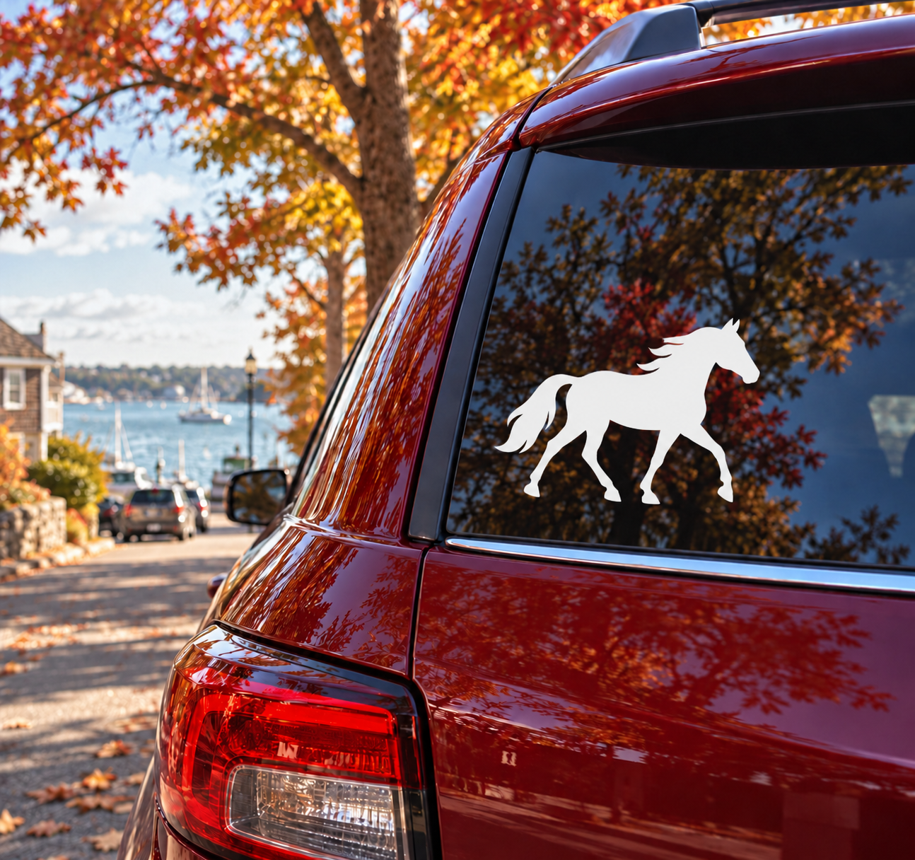 Horse silhouette vinyl decal on car window, black horse on white background