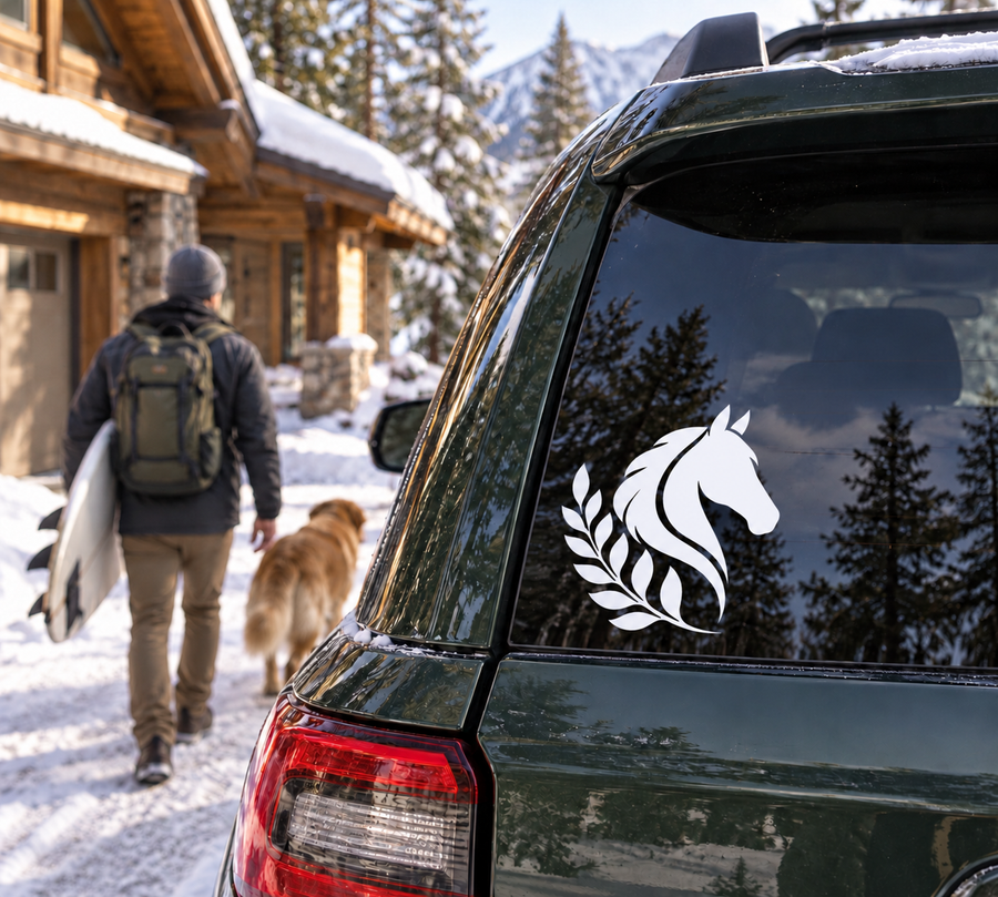 White horse and laurel vinyl decal on dark car rear window