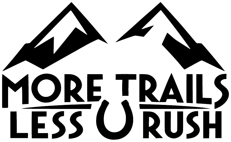 Vinyl decal with bold black 'MORE TRAILS LESS U RUSH' and mountain graphic