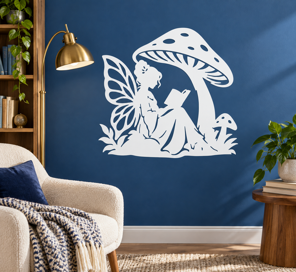 White vinyl book nook decal of a fairy reading under a large spotted mushroom.