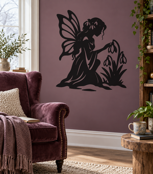 Black fairy vinyl decal silhouette with winged figure and snowdrop flowers