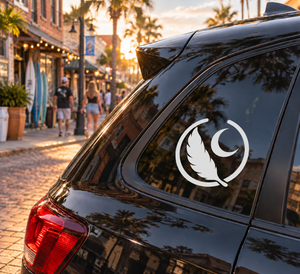 Feather and moon medallion vinyl decal, black silhouette on car window glass