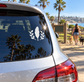 Feather and laurel vinyl decal on car rear window, white feather with leaf branches
