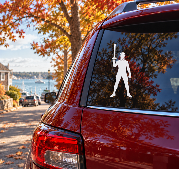Vinyl fencing decal of a saluting fencer figure in white on car window
