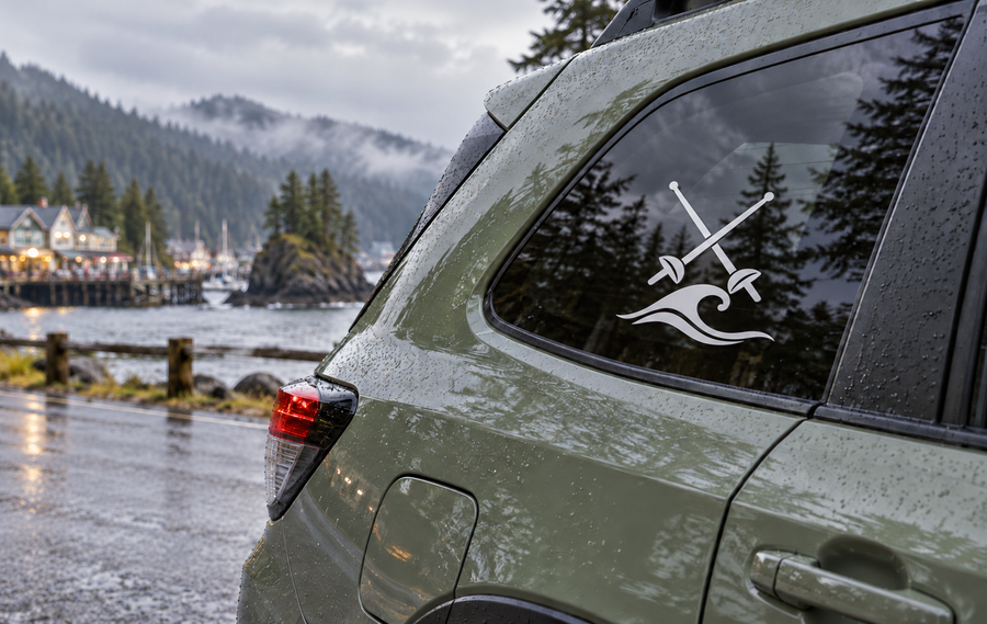 Black crossed-swords and wave vinyl decal on car window