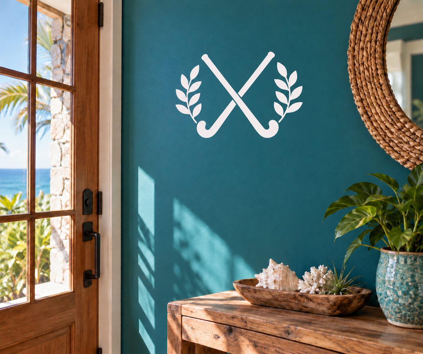 Field hockey crossed sticks with laurel leaves vinyl decal, white on dark teal wall
