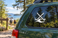 White field hockey decal with crossed sticks over a wave swirl on a car window