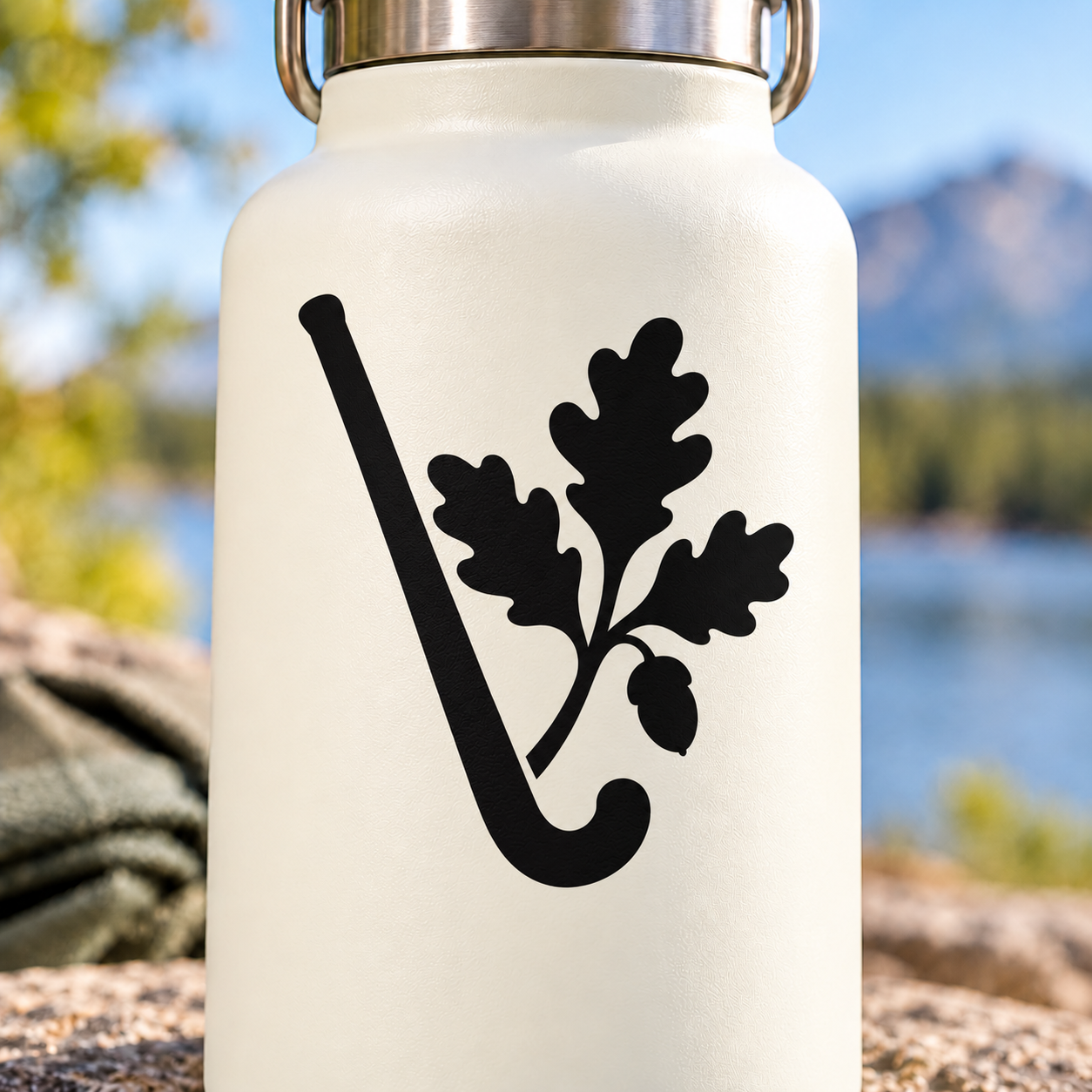 Field hockey vinyl decal: black stick with oak leaves and acorns on white bottle