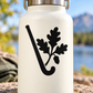 Field hockey vinyl decal: black stick with oak leaves and acorns on white bottle