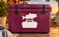 White vinyl fish and tackle box decal on maroon tackle box