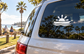 White fishing boat horizon vinyl decal on car rear window with sun and waves