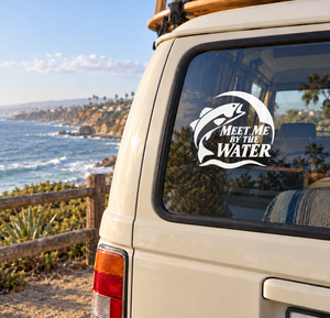 Vinyl fishing decal with black-and-white fish and text “Meet Me By the Water” on car window