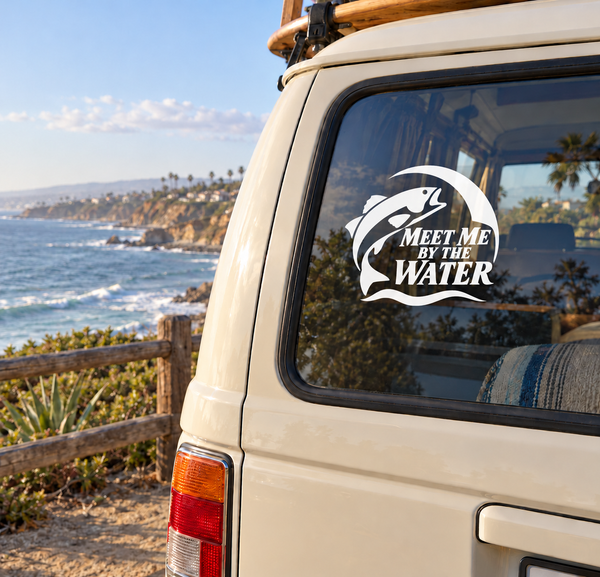 Vinyl fishing decal with black-and-white fish and text “Meet Me By the Water” on car window