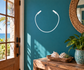 Vinyl jump rope loop decal with white outline and handle ends on a wall