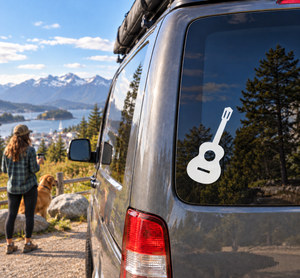 Spanish guitar emblem vinyl decal on car window, black guitar with white outline