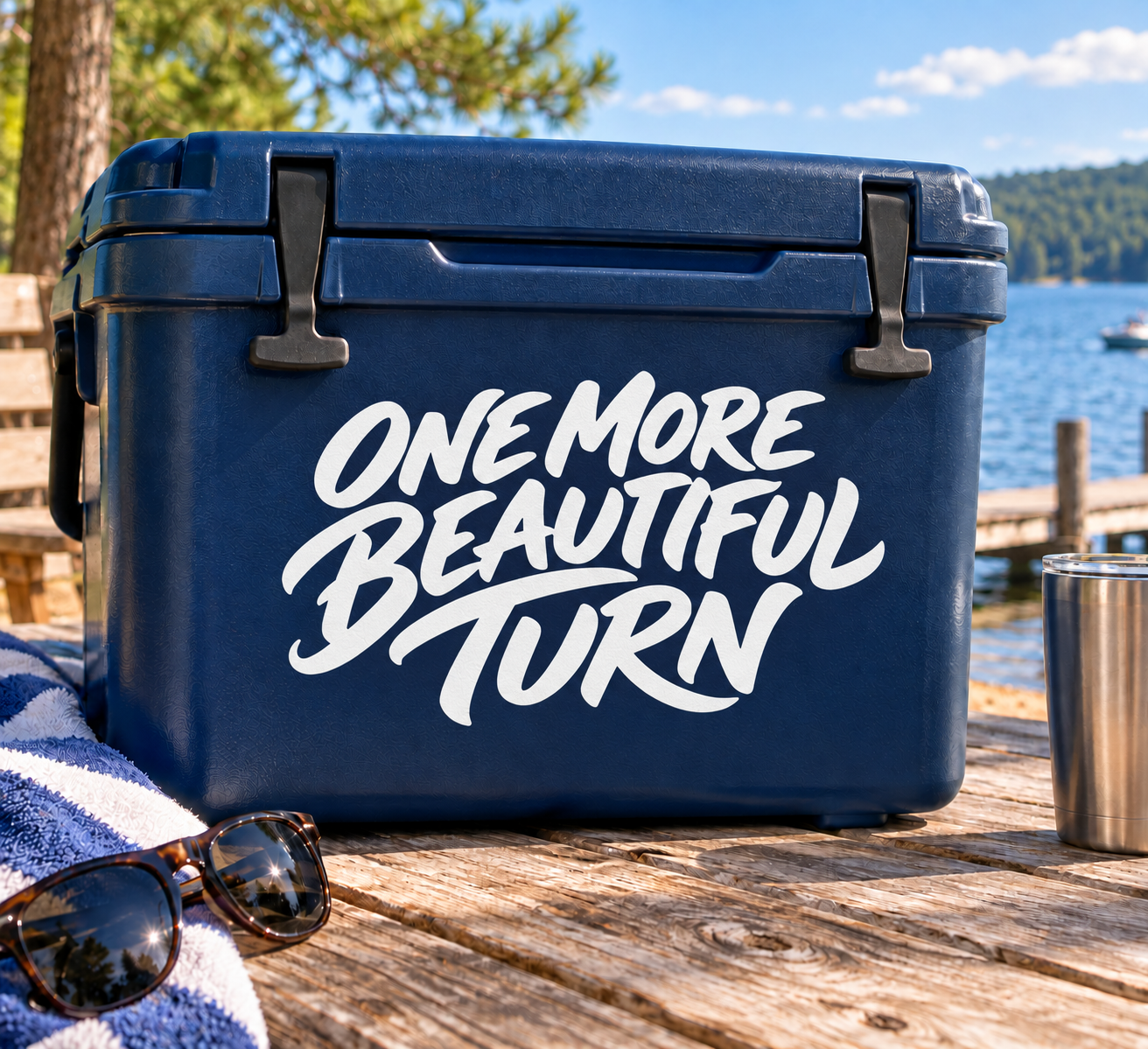 Vinyl decal reading "ONE MORE BEAUTIFUL TURN" in white script on dark blue